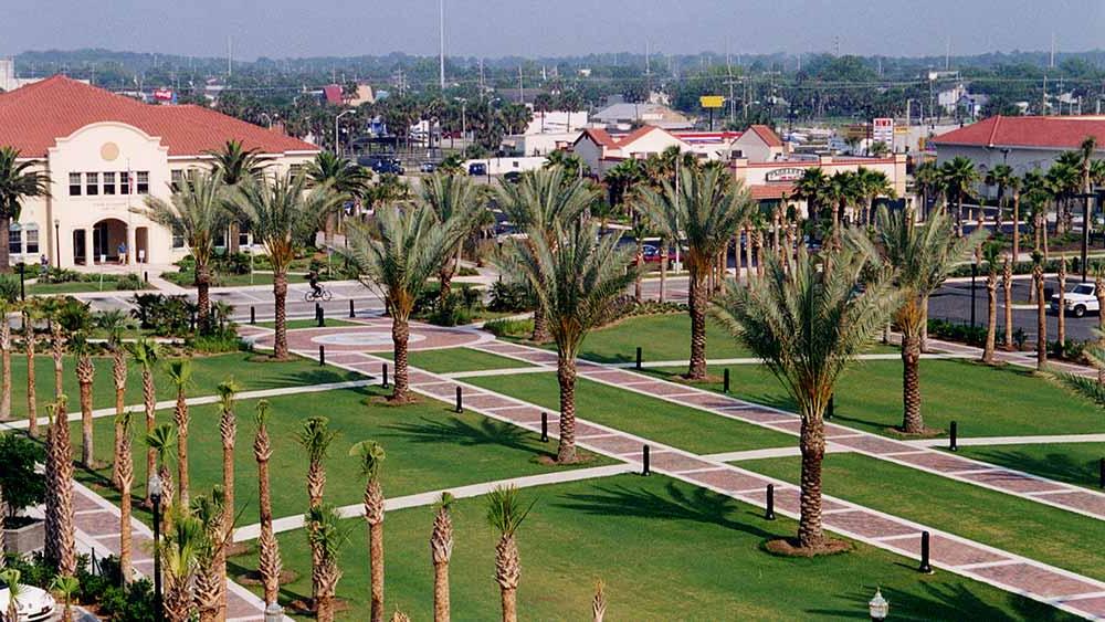 Palm trees line brick sidewalks that lead throughout the location.